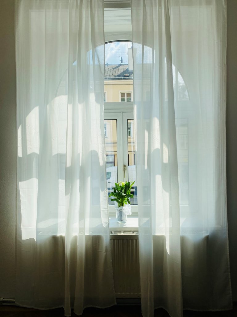 a bright and decorated window in the office of therapinum